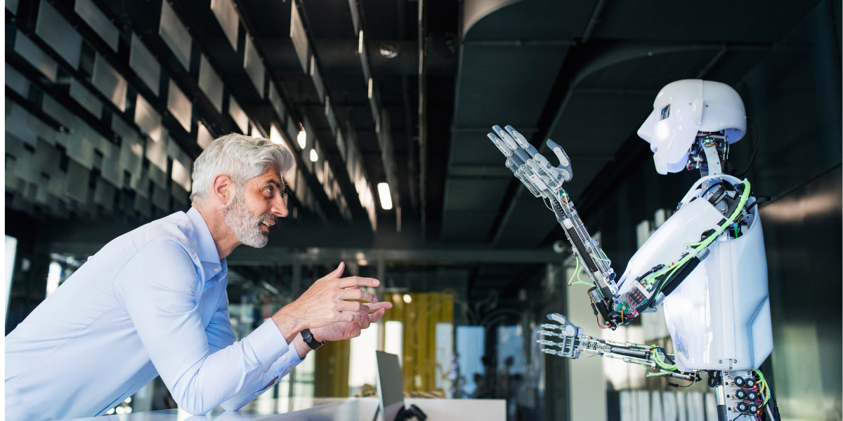 image of a human and a humanoid robot interacting